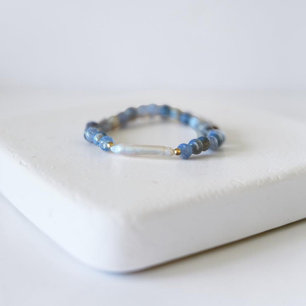 Blue Fire Agate, freshwater baroque pearl, and gold filled stretch bracelet by Poppies & Jules. This is a close up of the pearl.