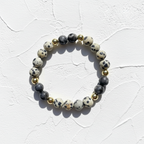 Dalmatian Jasper Bracelet - No Dish. This is with white texture background. The bracelet is close up shot.