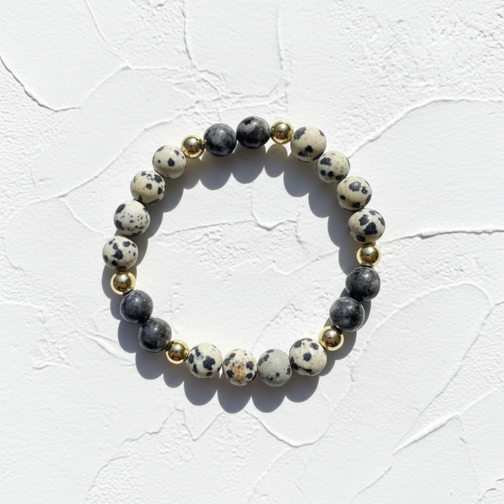 Dalmatian Jasper Bracelet - No Dish. This is with white texture background. The bracelet is close up shot.