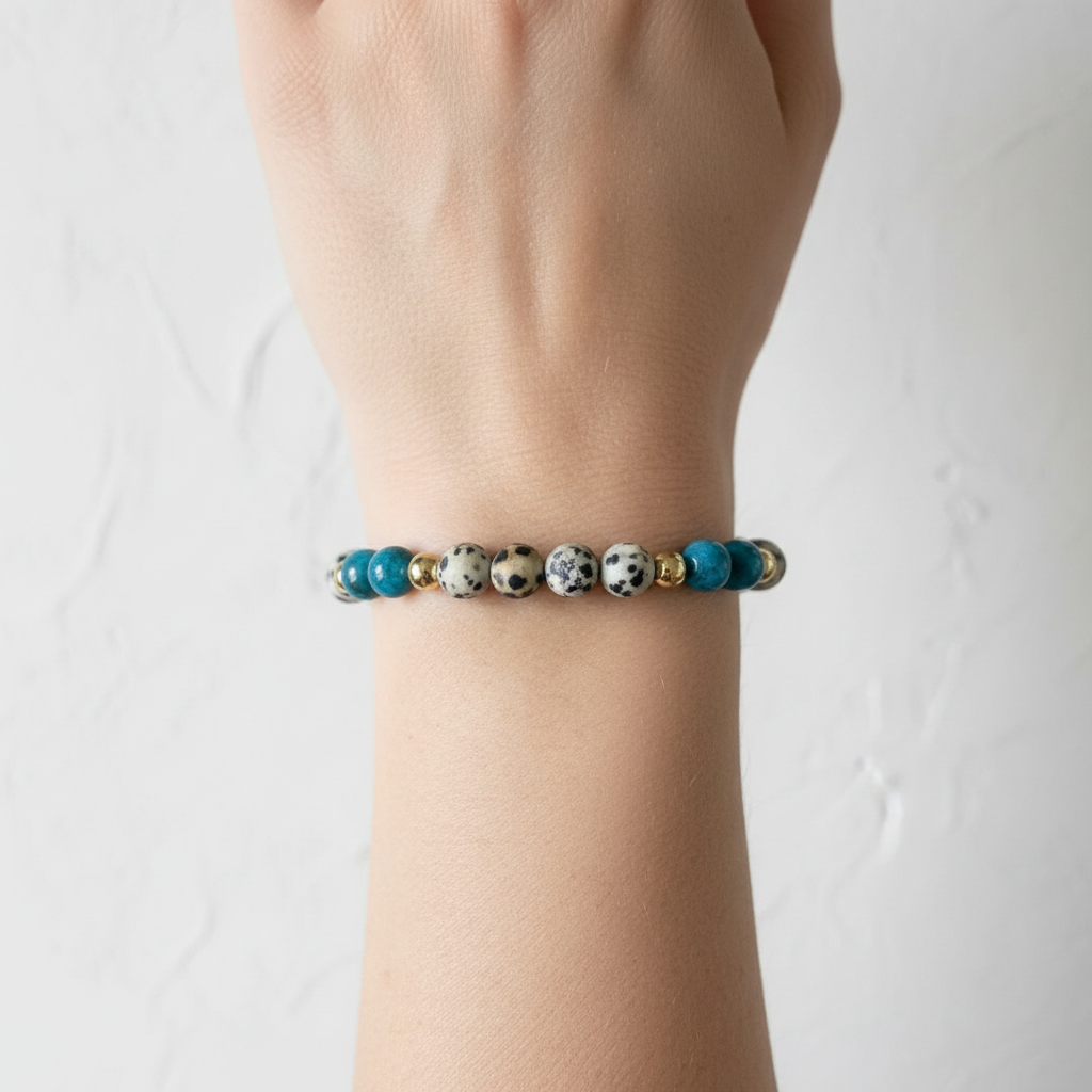 The Dottie Bracelet - Wrist Shot.This is a clsoe up of an arm, with the spotted and blue bead bracelet on the wrist.