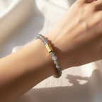 A close up of The Marlowe Bracelet on a womens wrist. The color is a gray mystic shade.